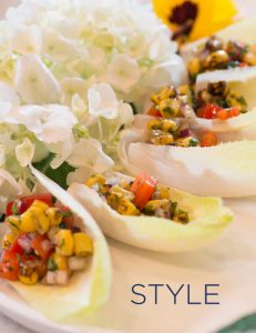 Endive appetizer closeup artfully arranged with hydrangeas with the word STYLE over the image