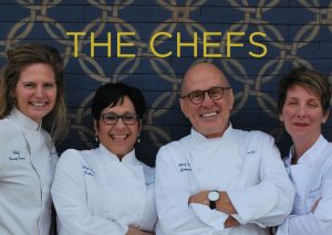 THE CHEFS. All four chefs hamming it up for a picture against the blue brick wall outside of Marché